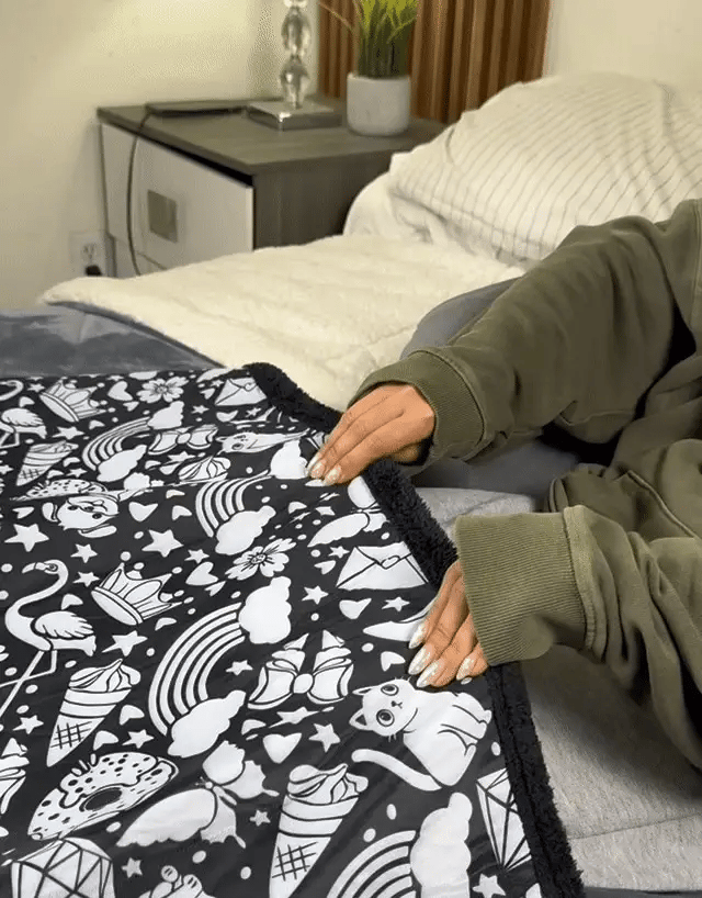Intricate coloring blanket design being filled in